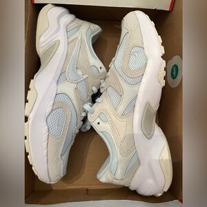 Women’s size 9 Stylish White and Cream Nike Sneakers